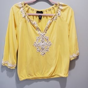 Inc yellow top with silver embellishment